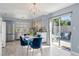 Bright dining area with stainless steel appliances and access to the outdoor patio at 7507 Pacific Heights Cir, Orlando, FL 32835