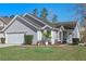 Beautifully landscaped home with a charming entrance and a well-manicured lawn at 7507 Pacific Heights Cir, Orlando, FL 32835