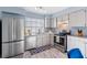 Well-lit kitchen featuring stainless steel appliances and ample counter space at 7507 Pacific Heights Cir, Orlando, FL 32835
