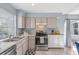 Modern kitchen featuring stainless steel appliances and ample counter space at 7507 Pacific Heights Cir, Orlando, FL 32835