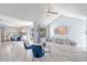 Open-concept living room with vaulted ceilings and modern flooring, ideal for entertaining at 7507 Pacific Heights Cir, Orlando, FL 32835