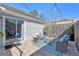 Outdoor patio featuring stylish seating and string lights, with easy access to indoor living area at 7507 Pacific Heights Cir, Orlando, FL 32835