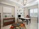 Office with built-in shelves, a ceiling fan, and a neutral color scheme at 8400 Bridgeport Bay Cir, Mount Dora, FL 32757