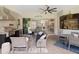 Outdoor kitchen, bar, and patio with a view to the adjacent living room at 8400 Bridgeport Bay Cir, Mount Dora, FL 32757