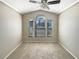 Sunlit bedroom with large windows and a ceiling fan provides a relaxing atmosphere at 8603 Primrose Dr, Kissimmee, FL 34747