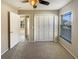Cozy bedroom features a closet, window for natural light, and plush carpeting at 8603 Primrose Dr, Kissimmee, FL 34747