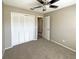 Bedroom with neutral walls, carpet, and a large closet at 8603 Primrose Dr, Kissimmee, FL 34747