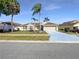 Charming single-story home featuring a well-maintained lawn and a two-car garage at 8603 Primrose Dr, Kissimmee, FL 34747