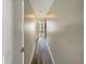 Long hallway with wood floors leading to rooms, showcasing the home's layout at 8603 Primrose Dr, Kissimmee, FL 34747