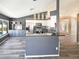 Modern kitchen featuring stainless steel appliances, ample counter space, and stylish gray and white cabinetry at 8603 Primrose Dr, Kissimmee, FL 34747