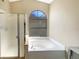 Well-lit bathroom with a jacuzzi tub and a glass door shower with a window for natural light at 8603 Primrose Dr, Kissimmee, FL 34747