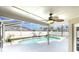 Covered patio with view of pool that offers cool relaxation with a ceiling fan to stir the air at 8603 Primrose Dr, Kissimmee, FL 34747