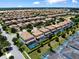 Aerial view of a dense residential area featuring uniform homes, screened pools, and green spaces at 9023 Shadow Mountain St, Davenport, FL 33896