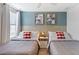 A bedroom featuring two beds with red-checkered pillows and framed Mickey and Minnie Mouse artwork at 9023 Shadow Mountain St, Davenport, FL 33896