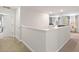 Spacious upstairs hallway leading to bedrooms and living room at 9023 Shadow Mountain St, Davenport, FL 33896