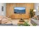 Cozy living room featuring tile floors, modern decor, and a large wall mounted television at 9023 Shadow Mountain St, Davenport, FL 33896
