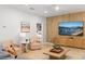 Open living room with tile floors, ceiling fan, modern decor and furnishings at 9023 Shadow Mountain St, Davenport, FL 33896