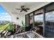 Inviting balcony with a fan, table, chairs, and lovely views; an ideal relaxation spot at 111 E Monument Ave # 705, Kissimmee, FL 34741