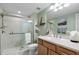 Bathroom featuring glass shower, neutral tiling, stylish decor, and vanity with modern sink and fixtures at 111 E Monument Ave # 705, Kissimmee, FL 34741