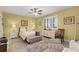 Bright and airy bedroom with neutral tones, plantation shutters, and stylish furnishings at 111 E Monument Ave # 705, Kissimmee, FL 34741