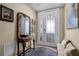 Inviting foyer featuring a decorative door, console table, rug, and a bench at 111 E Monument Ave # 705, Kissimmee, FL 34741