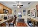 Well-lit home office with custom built-ins, neutral walls, and stylish decor at 111 E Monument Ave # 705, Kissimmee, FL 34741