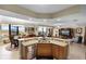 Spacious kitchen with granite countertops, a large island, and an open layout at 111 E Monument Ave # 705, Kissimmee, FL 34741
