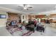 Stylish living room with a leather sofa, a large rug, and an accent chair at 111 E Monument Ave # 705, Kissimmee, FL 34741