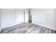 This bright bedroom has wood floors and lots of closet space at 1100 Delaney Ave # F409, Orlando, FL 32806