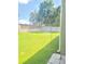 Expansive backyard featuring a well-kept lawn, mature trees, and partial fencing at 13413 Zori Ln, Windermere, FL 34786
