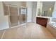 Bathroom with separate glass shower, soaking tub, and vanity with tile flooring at 13413 Zori Ln, Windermere, FL 34786