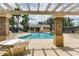 Enjoy a refreshing swim in the community pool surrounded by comfortable lounge chairs and a covered patio area at 13413 Zori Ln, Windermere, FL 34786