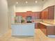 Spacious kitchen with wood cabinets, stainless steel appliances, and tile backsplash at 13413 Zori Ln, Windermere, FL 34786