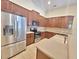 Well-equipped kitchen with stainless steel appliances and granite countertops at 13413 Zori Ln, Windermere, FL 34786