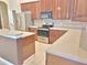 Featuring stylish countertops, stainless steel appliances, and ample cabinet space at 13413 Zori Ln, Windermere, FL 34786