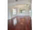 Open living room boasts hardwood floors, recessed lighting, and an elegant chandelier for a luxurious feel at 13413 Zori Ln, Windermere, FL 34786