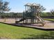 Community playground featuring a slide, covered play area, and swings for outdoor fun at 13413 Zori Ln, Windermere, FL 34786