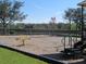 Community playground area with swings, a seesaw, and a wood chip safety ground at 13413 Zori Ln, Windermere, FL 34786