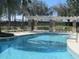 Community pool with lounge area at 13413 Zori Ln, Windermere, FL 34786