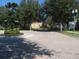 Residential street featuring manicured landscaping, lake views and charming streetlights at 13413 Zori Ln, Windermere, FL 34786