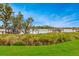 Lakeside view featuring a dock and lush green landscape, perfect for relaxation at 13413 Zori Ln, Windermere, FL 34786