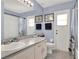 Bright bathroom with a sink, shower, toilet and other amenities at 14540 Pointe East Trl, Clermont, FL 34711