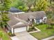 Charming single-Gathering home with a two-car garage, screened pool, and well-manicured lawn at 14540 Pointe East Trl, Clermont, FL 34711