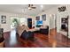Bright living room with hardwood floors and sliding glass doors to the outdoor space at 14540 Pointe East Trl, Clermont, FL 34711