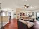 Bright living room with hardwood floors, comfortable seating, and an open floor plan perfect for entertaining at 14540 Pointe East Trl, Clermont, FL 34711