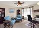 Bright office featuring neutral colors, comfortable seating, and a large window for natural light at 14540 Pointe East Trl, Clermont, FL 34711