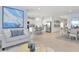 Open-concept living area featuring modern furnishings, dining area and a kitchen with an island at 146 Jones Fish Camp Rd, Edgewater, FL 32141