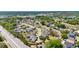 A scenic aerial view captures the layout of this villa community and the surrounding lush Florida landscape at 1489 Magellan Cir # 603, Orlando, FL 32818