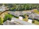 An aerial view of this Florida villa with mature landscaping, screen enclosed lanai, and pristine landscaping at 1489 Magellan Cir # 603, Orlando, FL 32818