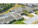 An aerial view of this Florida villa with screen enclosed lanai, mature landscaping, and well-maintained lawns at 1489 Magellan Cir # 603, Orlando, FL 32818